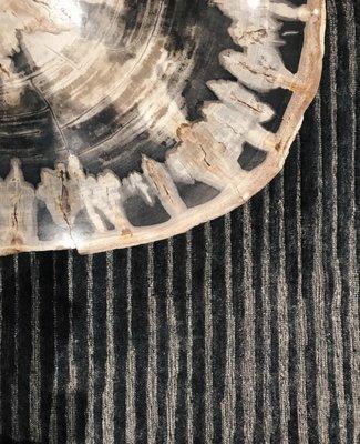 Our petrified wood stump and Cadence rug collection pair beautifully together...