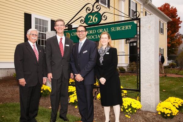 Drs. Stone, Trowbridge, Diamantis and Field (L to R) stand in front of our beautiful Chelmsford sign on Grand Opening day.