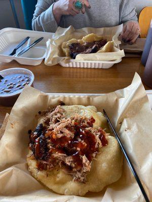 Pulled pork with spicy bbq sauce in front, brisket in rear. Flatbread. Delicious!