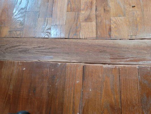 Hardwood flooring are not lined up. He used a 5" board