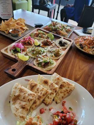 Taco party, chicken taquitos, cheese quesadilla and asada fries.