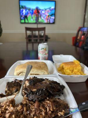 Jerk chicken, rice & peas, beef patty w/ cheese & cocoa bread, and Macaroni and Cheese