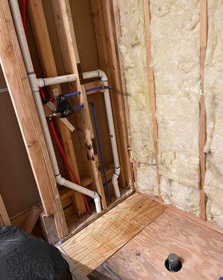 Tub to shower remodel after picture (we did the new drain, vent & water lines.)