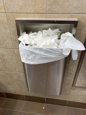 Bathroom trash is overflowing