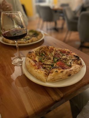 The Vincenzo Special Pizza and a glass of Cabernet Sauvignon