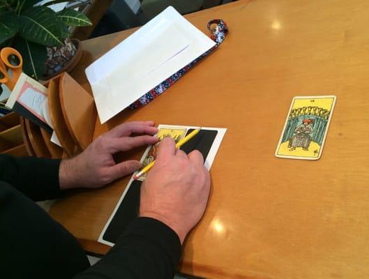 Neil is a master.  In this image he is triple checking the die cutting template for a replica of a virtually non-existent deck of old cards.