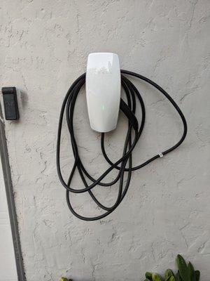 A Tesla wall connector installed by JJ Electric.