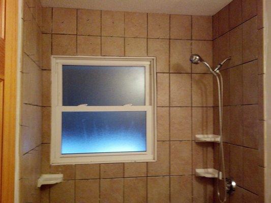 Shower Tiling job, almost complete with shelving.