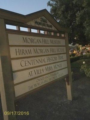 Signage showcases the Hiram Morgan Hill House and the Morgan Hill Museum. Yelp™ says the museum is at 600 W Main Ave.