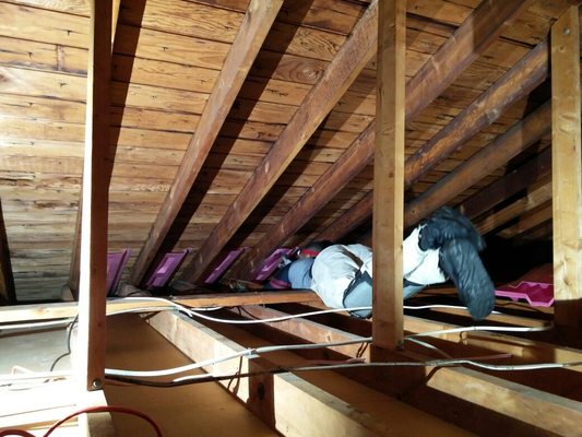 Installing baffles for proper air flow between the soffit and ridge vent.