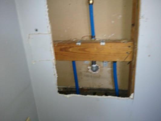 Replace tub valve and repair wall.