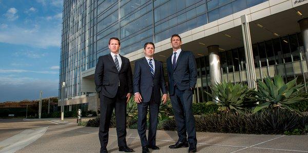 Firm partners Jason R. Thornton, P. Randolph Finch Jr., and Jeffrey B. Baird outside the firm's headquarter offices.