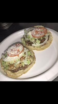 Sopes with any choice of meat it comes with beans, lettuce, onion, sour cream, and tomato $2.50 each