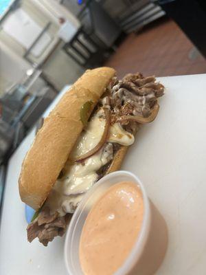 Philly cheesesteak on hoagie roll served with a side of our signature sriracha aioli sauce!