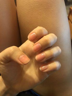 clear pink polish on nicely shaped natural nails :)