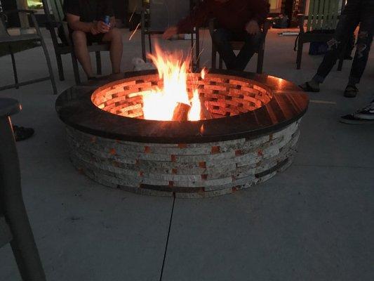 This custom firepit was designed by the customer, using recycled granite blocks and a slab top. Price varies.