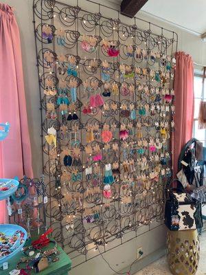 Ear ring wall made from an old bed spring.