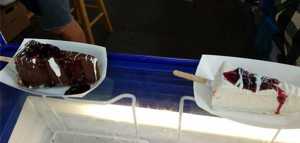 dark chocolate and white chocolate dipped cheesecake on sticks. WITH HUCKLEBERRY DELICIOUSNESS.