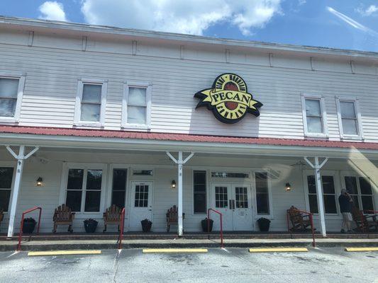 The store front with nice welcoming front porch with rocking chairs