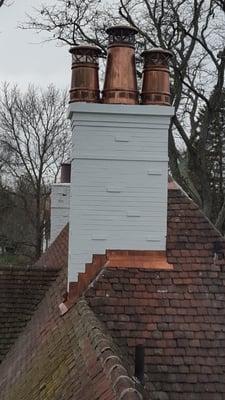 Fully Restored Historic Chimney with copper flashing and pots