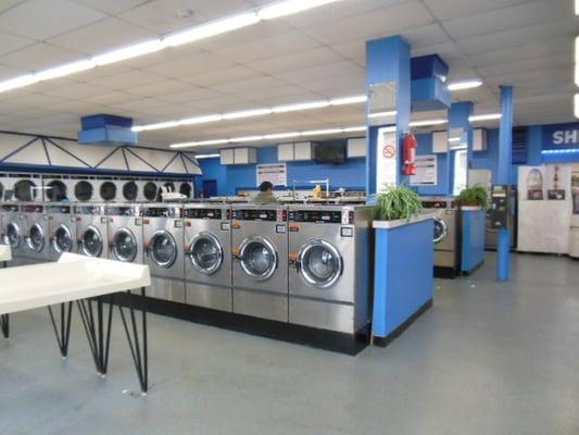 Store interior, recently remodeled with fresh paint; also with new washers and dryers. Laundry folding table also provided.