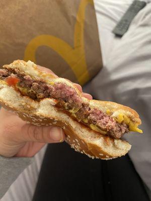 Raw quarter pounder burger