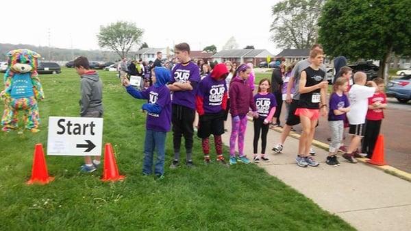 Confetti Bear cheering on the runners at Enon Fights Epilepsy 5K.