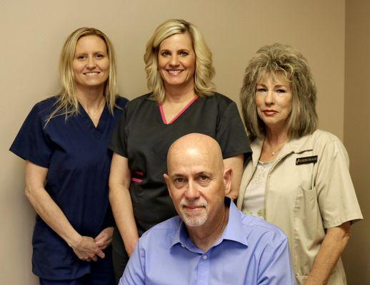 Dr Chudy and his staff, Rika, Carol and Deborah.