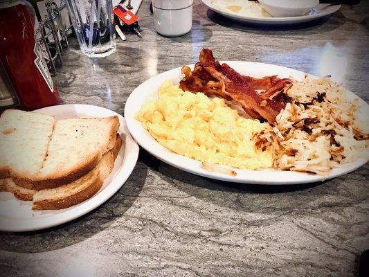 The "whole hog" breakfast combo w/ scrambled eggs, 4 bacon strips, hash brown & toast