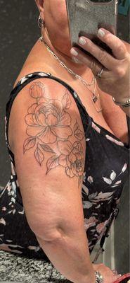 Start of my 1/2 sleeve stipple floral designed and tattooed by Chrissy