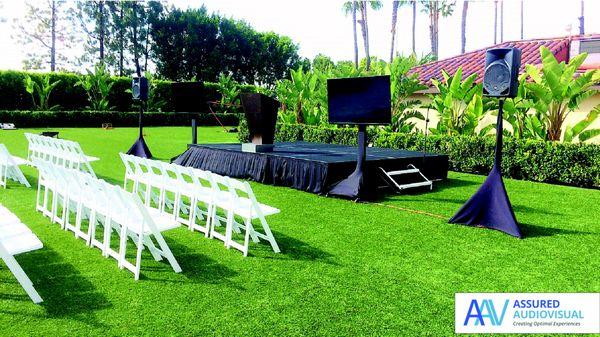 This outdoor meeting setup utilizes two large TVs and a high-quality sound system that is perfect for fundraisers and company-wide meetings.