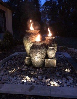 Bubbling urns with fire tops