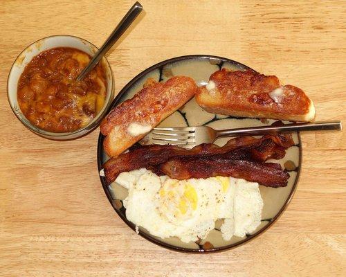 The toast in this image is Pan de Queso from Casa de Pan de Yuca, buttered and fried, and then buttered again. It is WONDERFUL!