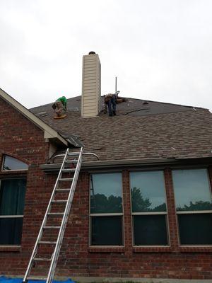 Using a ladder max to prevent damages to gutter or siding.