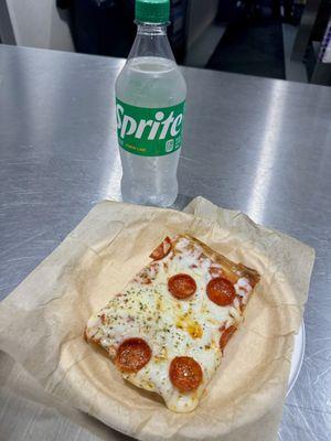 12.14.23 Paragary's Sicilian style pepperoni pizza slice and bottle of soda (inside Golden 1 Center)