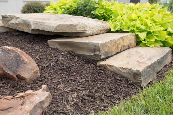 Improve the look of your landscape with Natural Hardwood Mulch & Natural Stone!