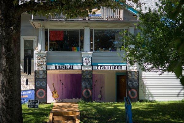 View of our shop from Westmoreland Ave (entrance is in the back). Sometimes you can catch a performance on the Stage of Musical Traditions!