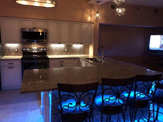 Kitchen with new cabinets, island, light fixtures & under cabinet lighting