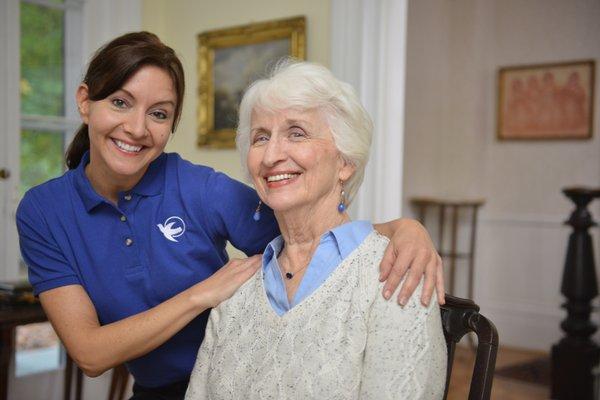 Visiting Angels caregiver visiting the home of her senior client.