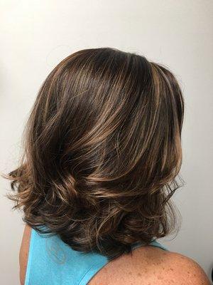 This client had about six inches taken off her length. Added highlights to breakup her dark base.