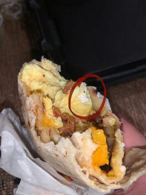 Bacon Breakfast Burrito with egg shells in it