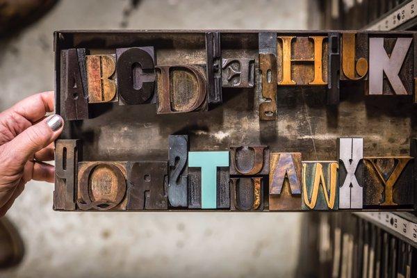 Some of the vintage wood type at Bremelo Press. Photo by Noah Fecks.