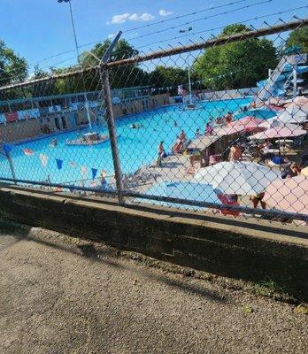 View of pool from walkway by entrance