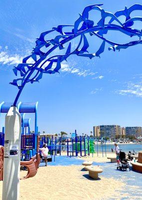 Cool sculptured archway as welcome gesture to the beach playground for kids