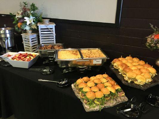 Sliders, Mac & Cheese, Teriyaki Wings and fruit salad.