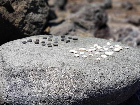 5/3/2019 - Konane (checkers) played on a stone board.