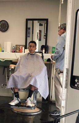 My son getting a much needed haircut. He walked out looking sharp!