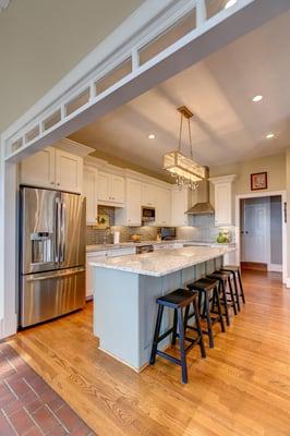 By removing a wall and installing a beam, considerable space was added to this old kitchen.  The result is outstanding!