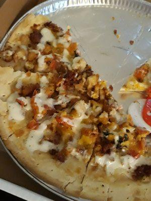 Chicken bacon ranch pizza. No sauce, just ranch salad dressing over the chicken and bacon.