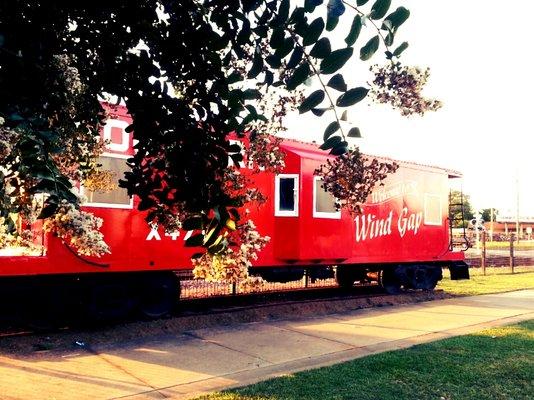 LAMAR ARTS CENTER & GALLERY restored caboose (currently being used as a film location; hence "Wind Gap, Missouri" signage).